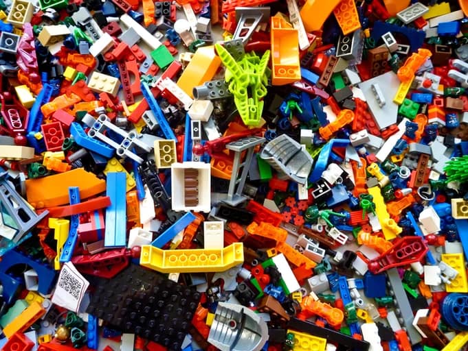cluttered legos in a pile - Get them decluttered with 15 decluttering tips!