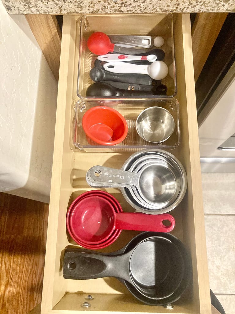 And organized drawer with kitchen measuring tools