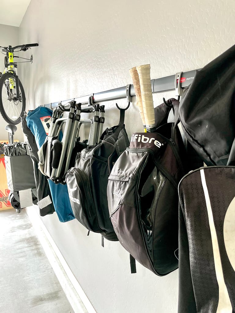 An organized garage using the fast rack system from rubbermaid