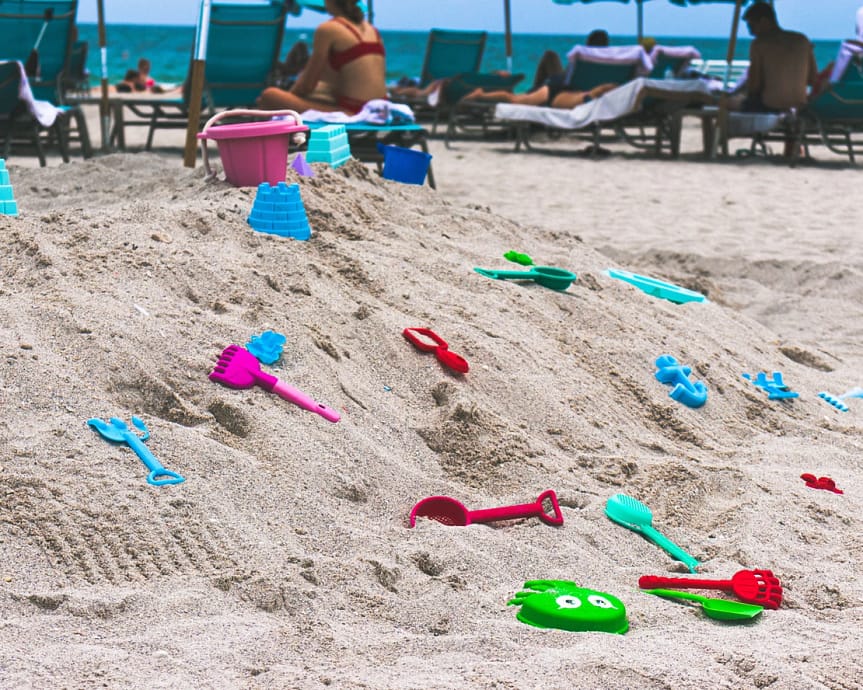 Plastic toys on a beach crating a plastic crisis
