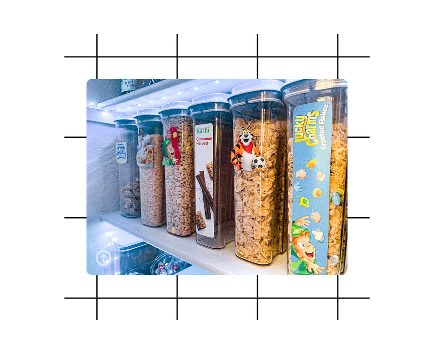 Organized cereal boxes with labels in oxo containers